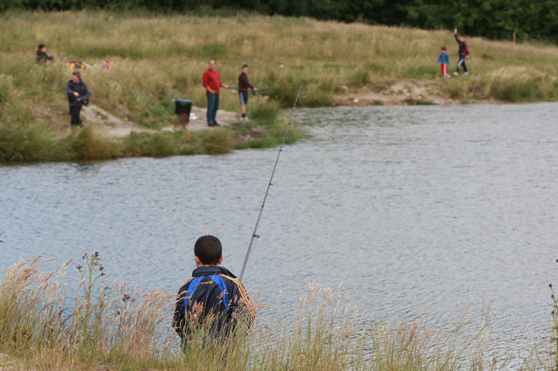 Families and young anglers fishing together at Laois Angling Centre