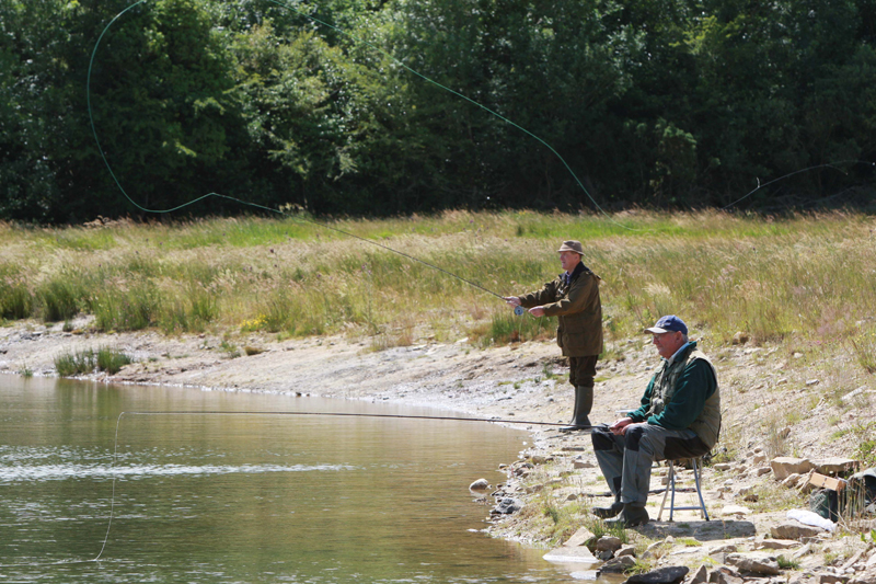 Two experienced anglers fly fishing on the lake at Laois Angling Centre